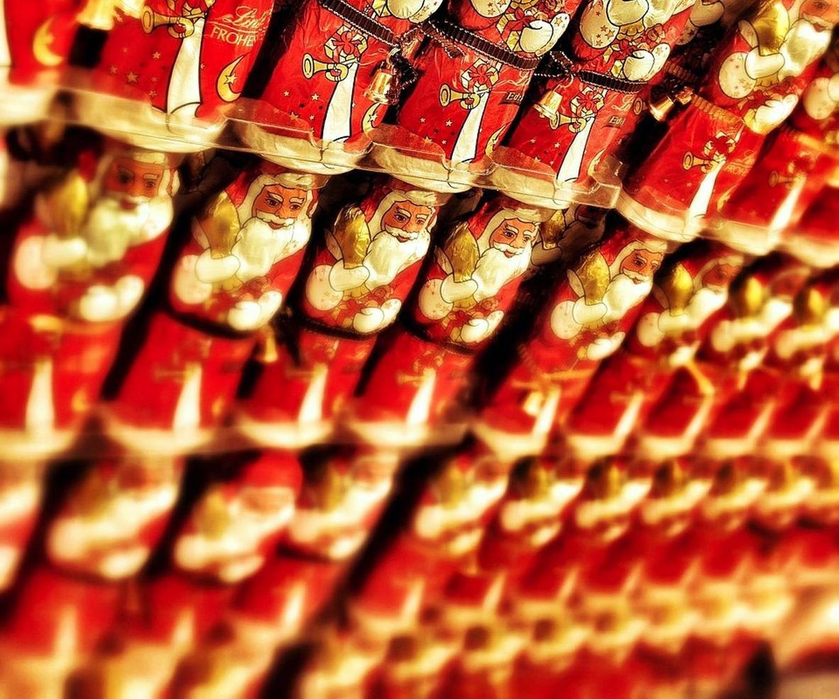 Shelves stocked with colorful wrapped sweets and chocolate boxes